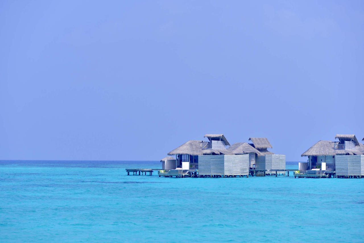 Serene overwater bungalows on turquoise waters in the Maldives.